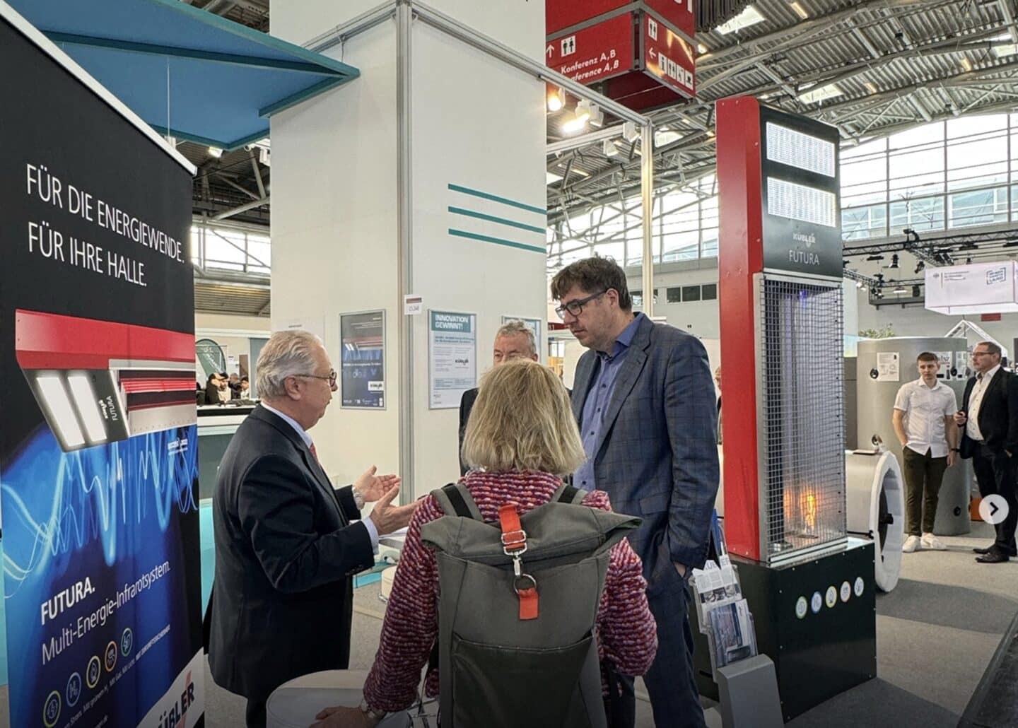 Exhibition stand with visitors and exhibits.