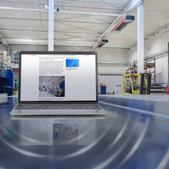 Laptop shows website of a factory building