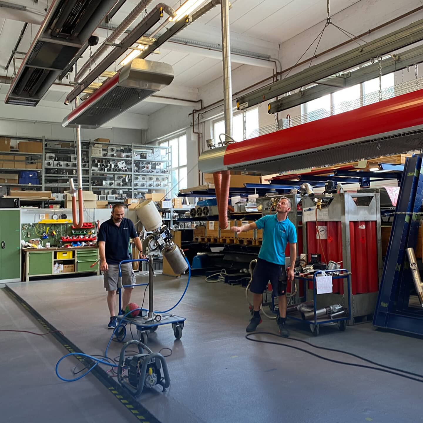 Men work with machines in the workshop