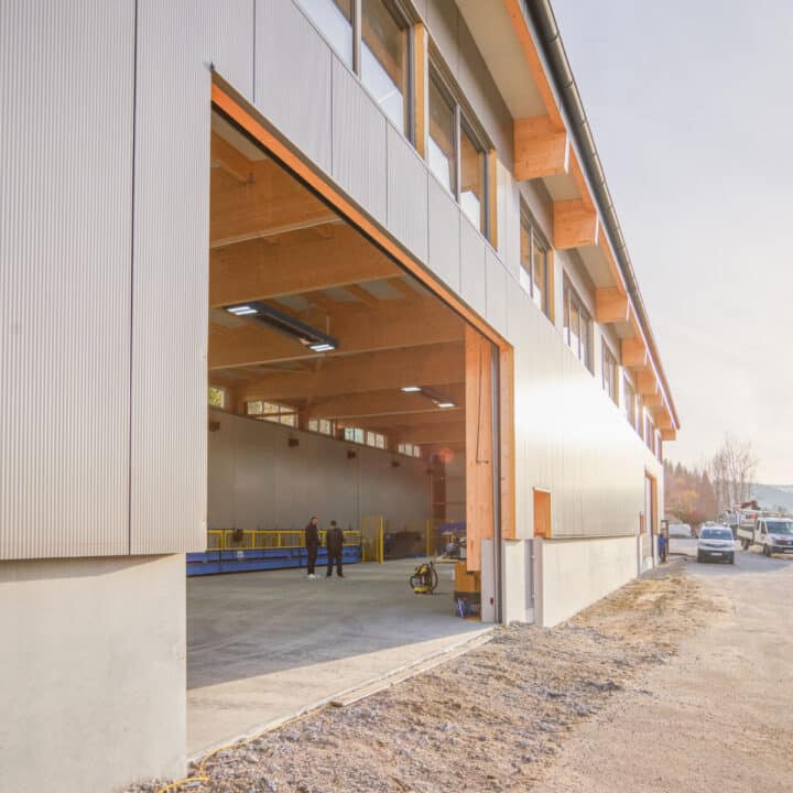 Modern industrial hall with wooden cladding during the day