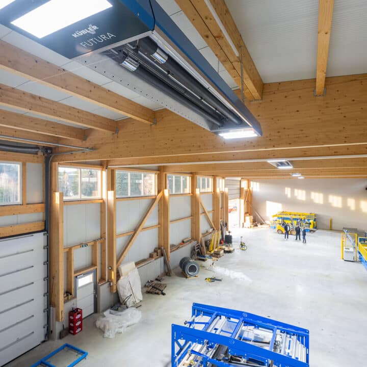 Bright workshop with wooden beams and construction machinery