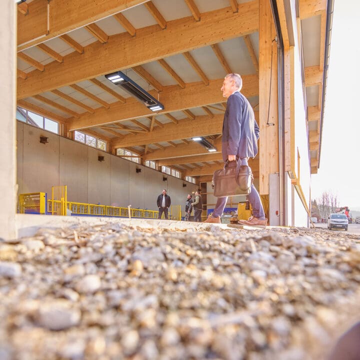 Man goes to construction site with briefcase