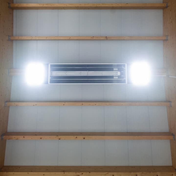 Lighting and ventilation system on wooden ceiling