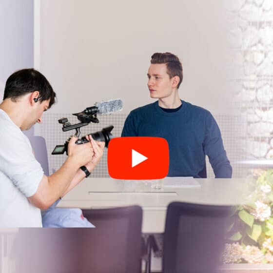 Two men in video recording with YouTube logo