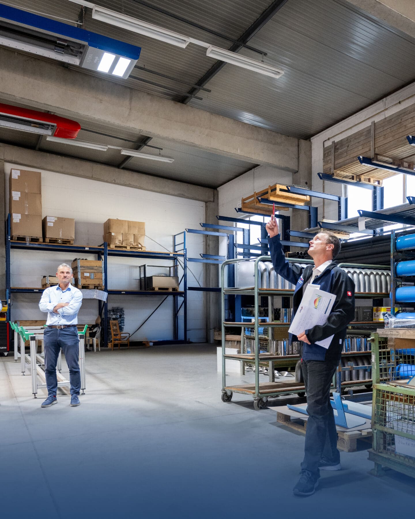 Two men in a warehouse with shelves