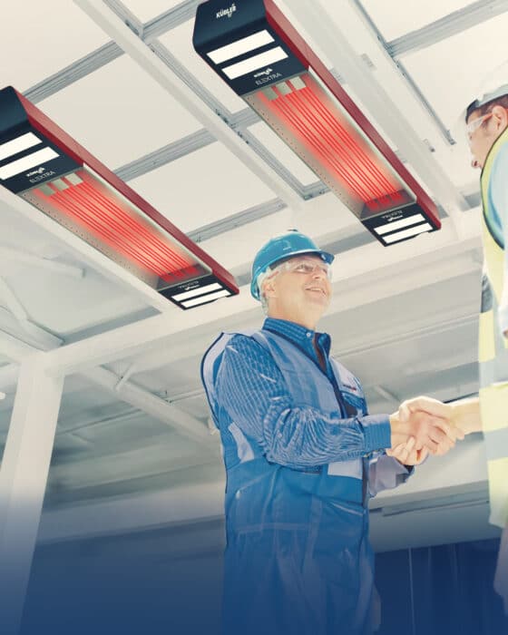 Handshake between two industrial workers under radiant heaters